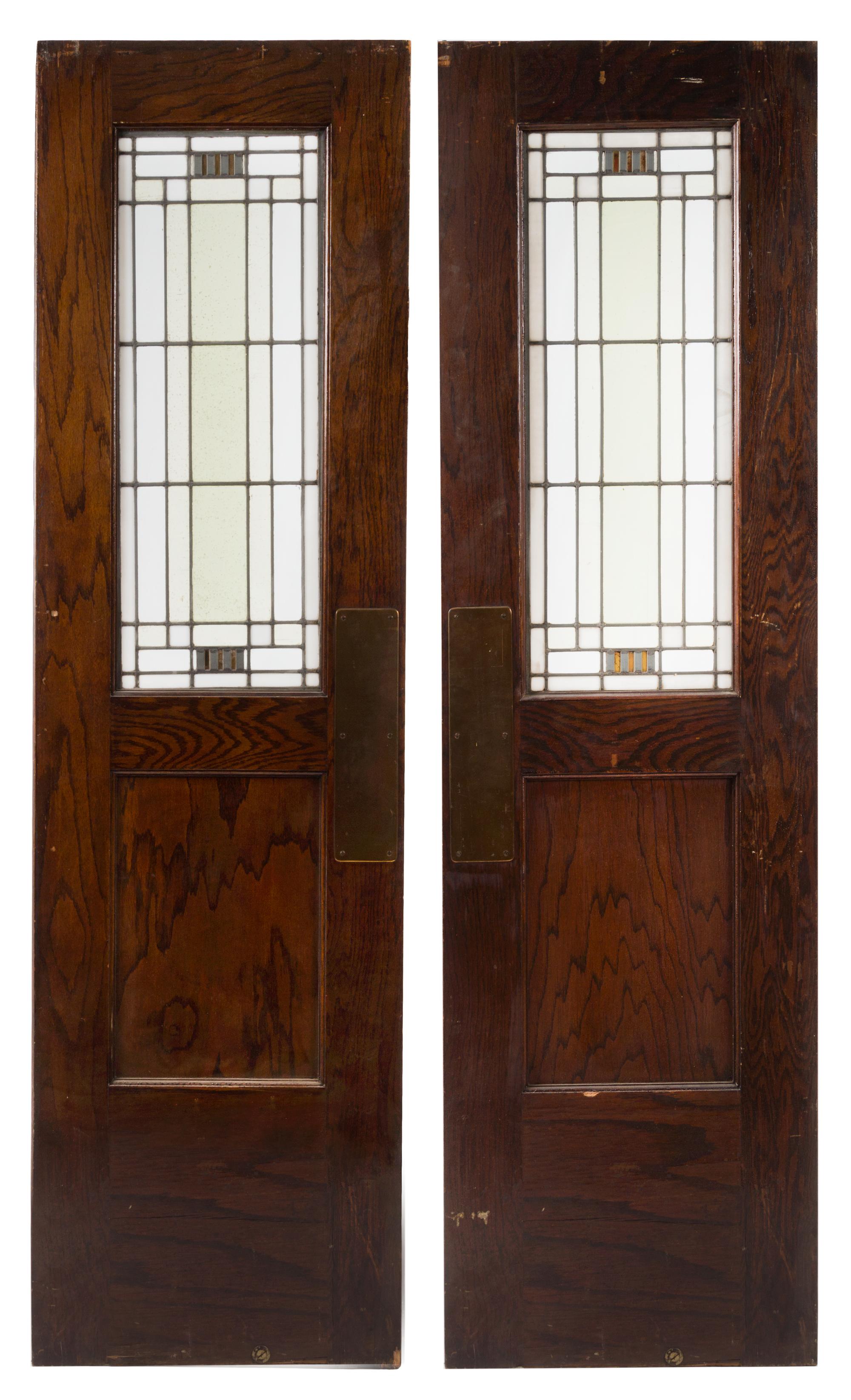 Attributed to William Eugene Drummond, (American, 1876-1948), a pair of American leaded-glass windows mounted in oak doors