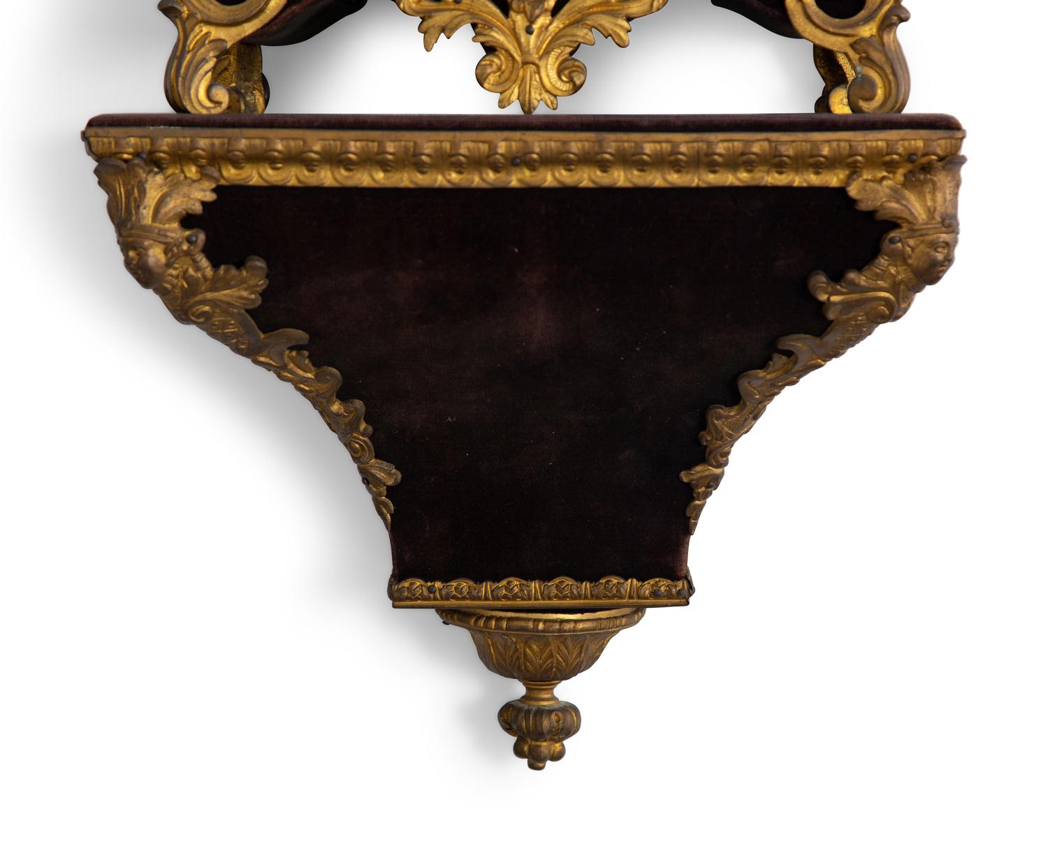 A Louis XV Style Gilt Bronze and Velvet Bracket Clock
