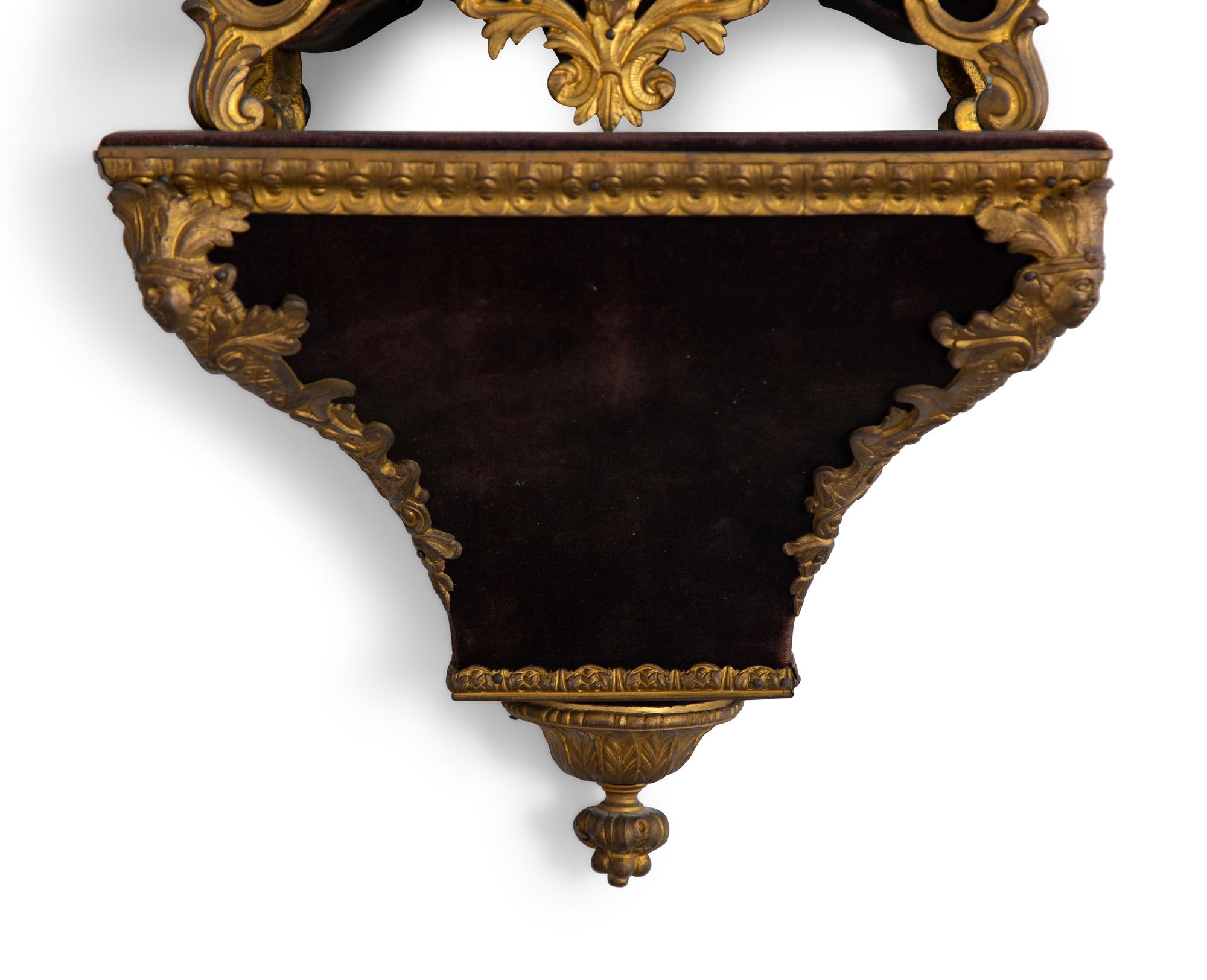 A Louis XV Style Gilt Bronze and Velvet Bracket Clock