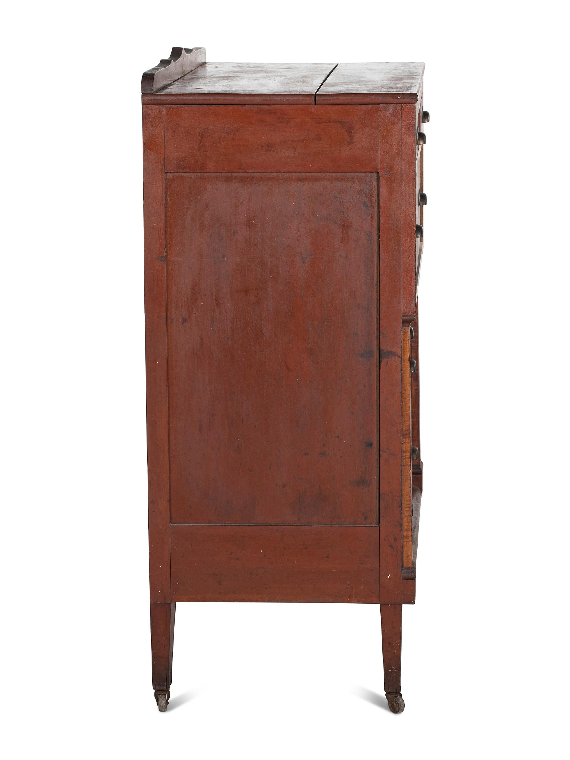An Ohio Mennonite Red-Stained Cherrywood and Tiger Maple Chest of Drawers
