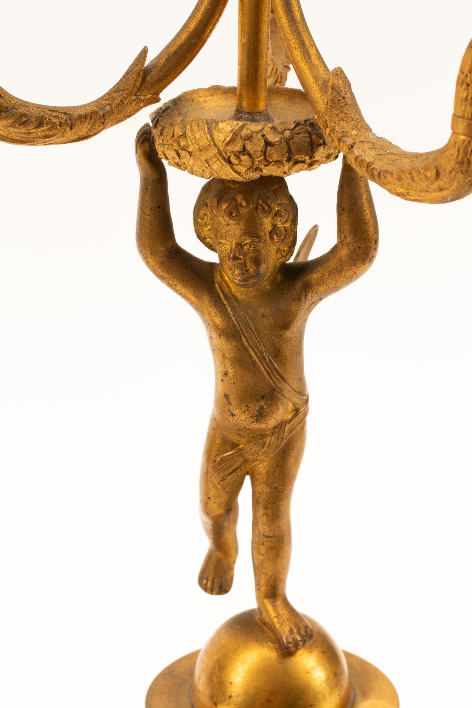 A Pair of Charles X Gilt Bronze Three-Light Candelabra