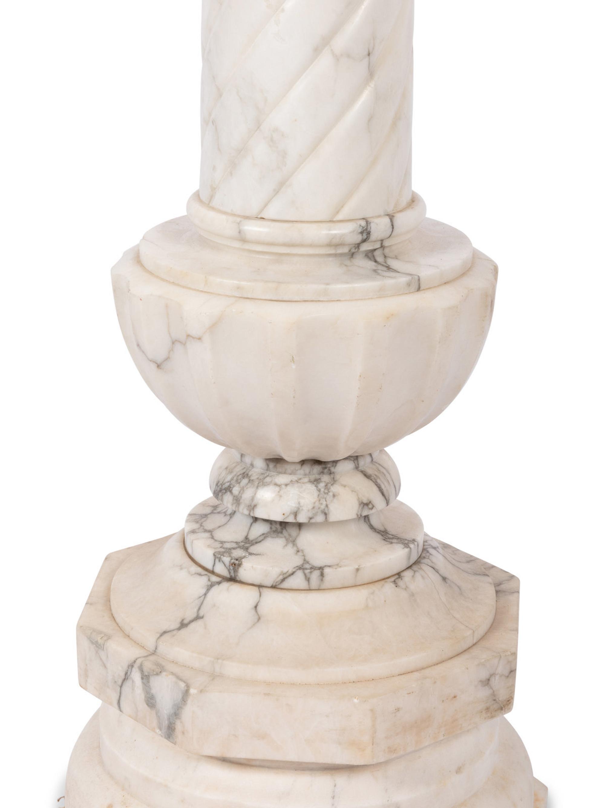 A Pair of Continental Carved Marble Pedestals