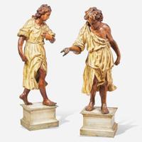 A pair of Italian carved and polychromed wood figures of young men 18th century