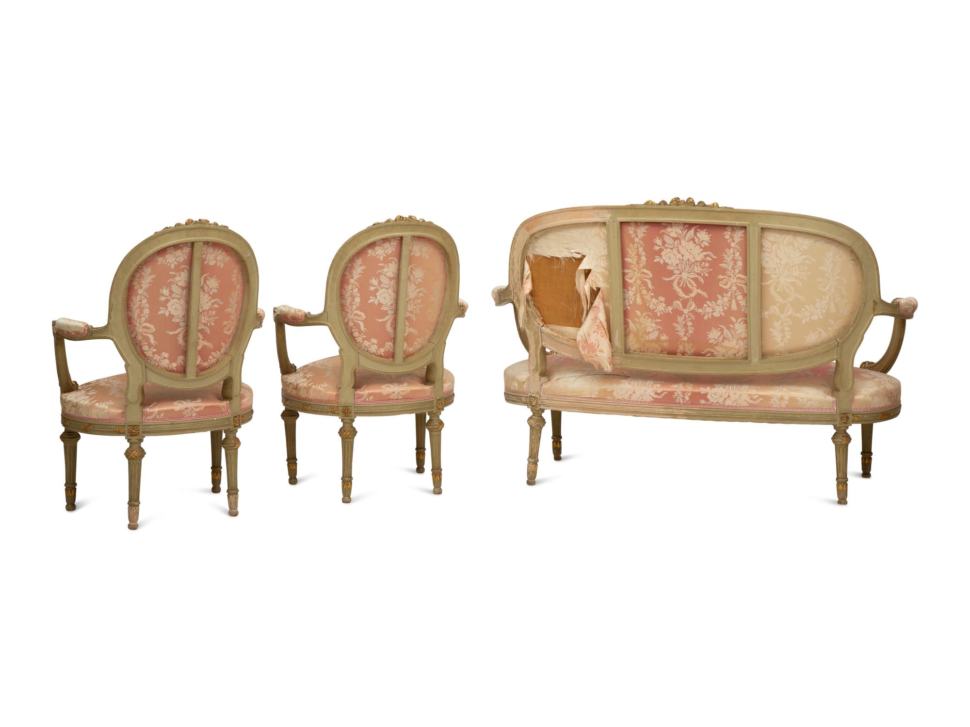 A Louis XVI Style Painted and Parcel Gilt Three-Piece Seating Suite