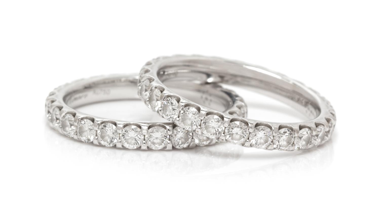 A Pair of 18 Karat White Gold and Diamond Eternity Bands, Memoire, 3.70 dwts.
