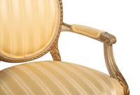 A Pair of Louis XVI Style Parcel Gilt and White Painted Fauteuils