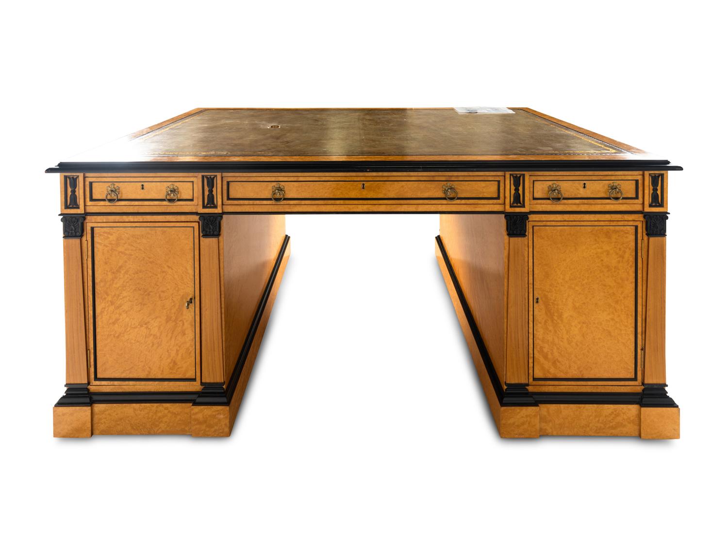 A Russian Neoclassical Style Birch and Parcel Ebonized Partner's Desk