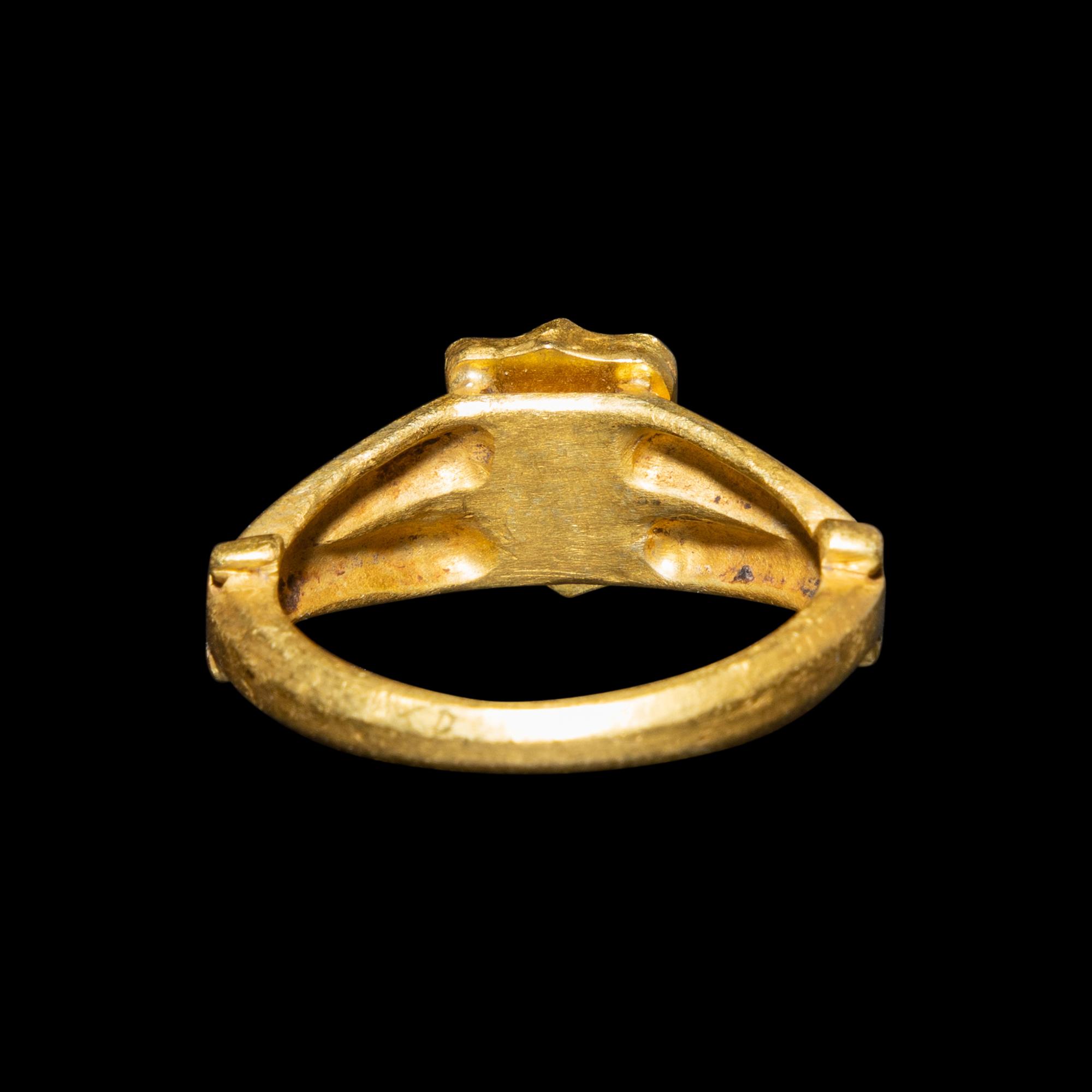 A Migration Period Gold and Spessartine Garnet Ring