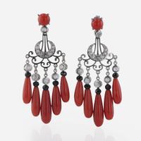 A Pair of Coral, Onyx, and Diamond Earrings