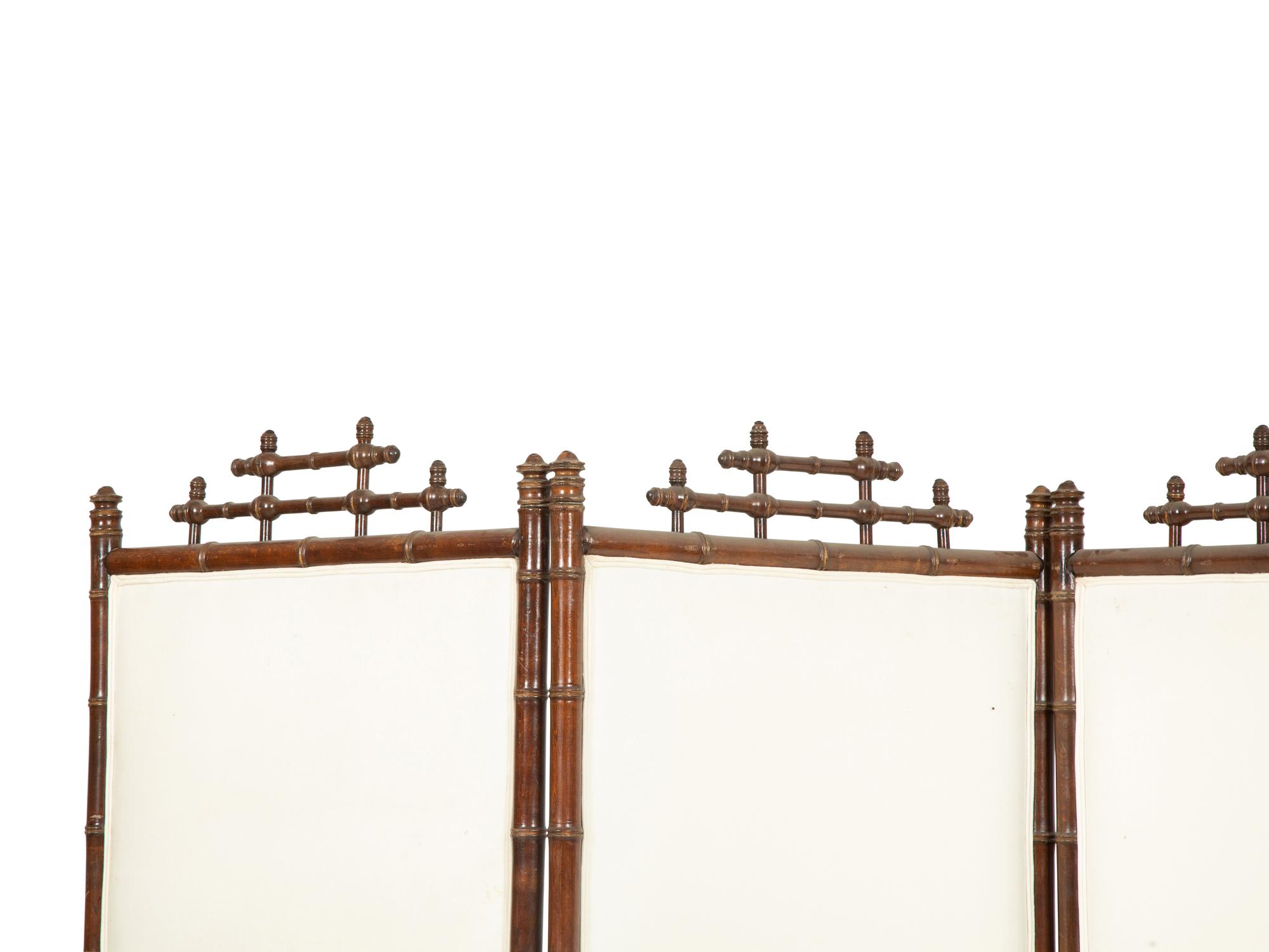 A Victorian Carved Mahogany and Parcel Gilt Faux-Bamboo Upholstered Four-Panel Screen