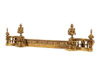 A Louis XVI Style Brass Fire Fender and Chenets