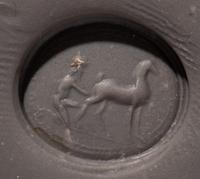 A Roman Carnelian Ring Stone with a Goatherder Milking a Goat
