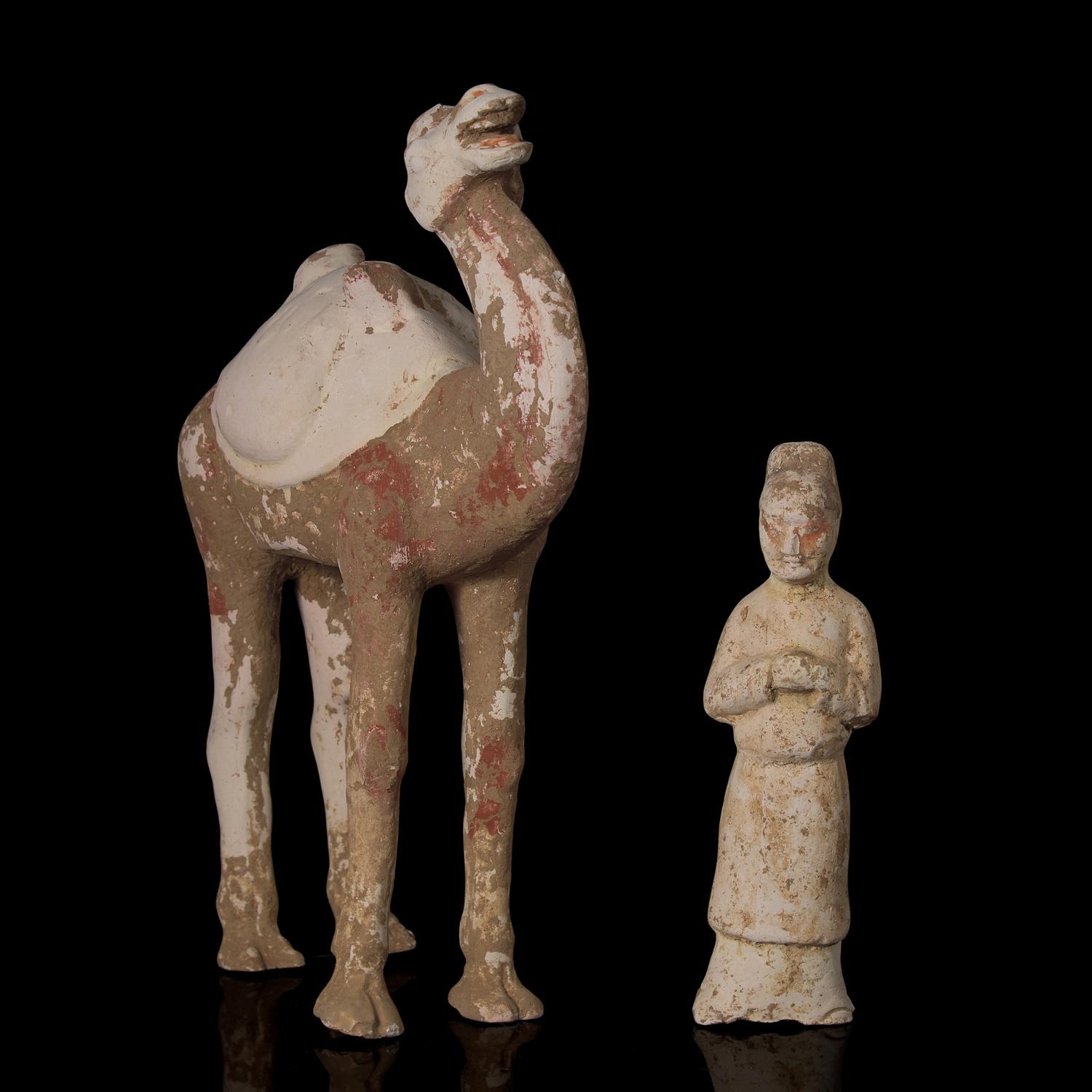 A Chinese Painted Pottery Figure of a Camel and A Pottery Figure of an Attendant, Tang Dynasty 唐 彩陶駱駝及男佣各一