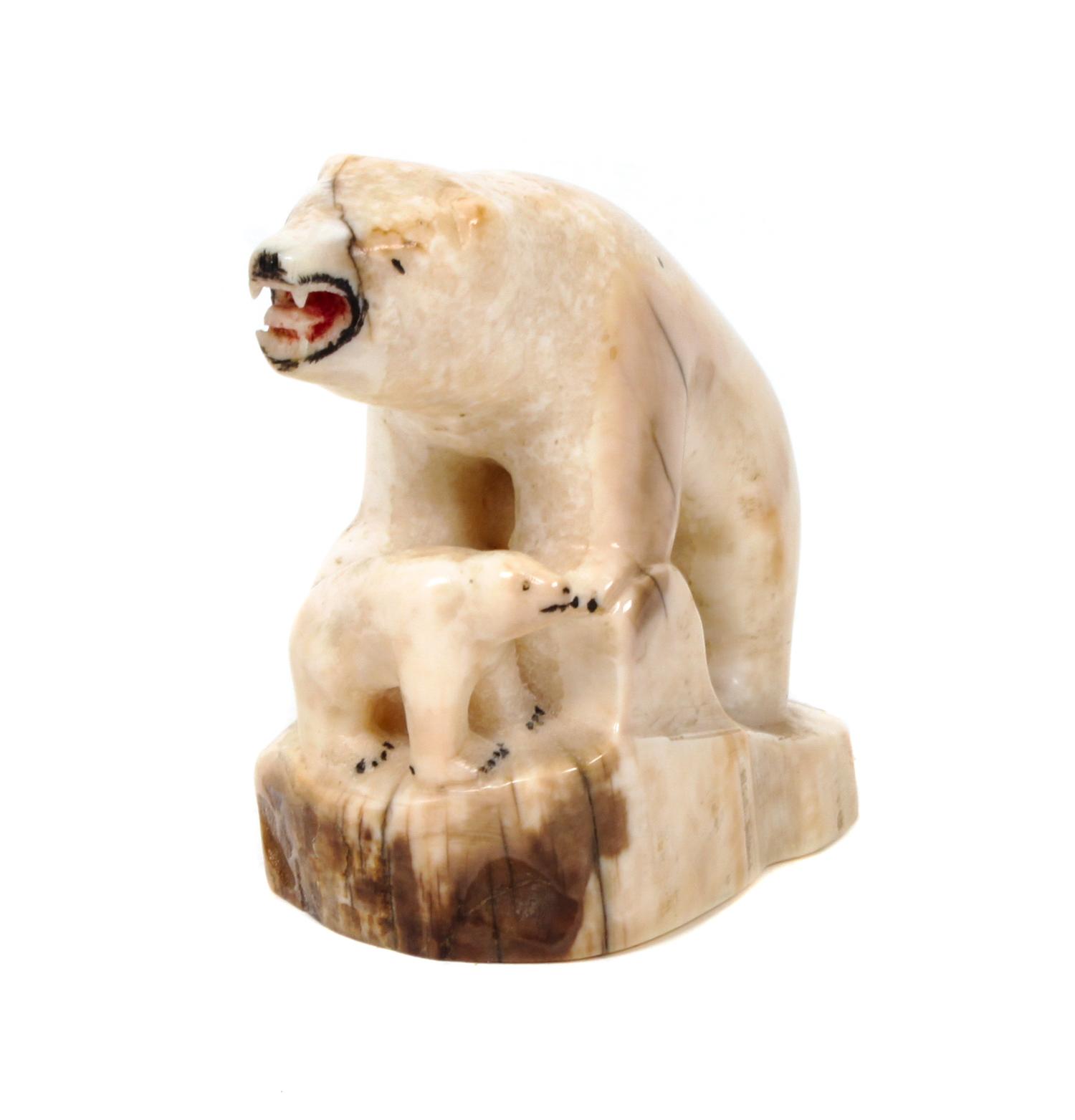 An Inuit Carved Walrus Bone Figurine Height 3 x width 3 5/8 inches.