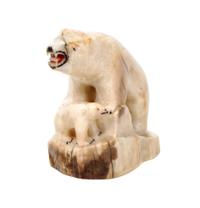 An Inuit Carved Walrus Bone Figurine Height 3 x width 3 5/8 inches.