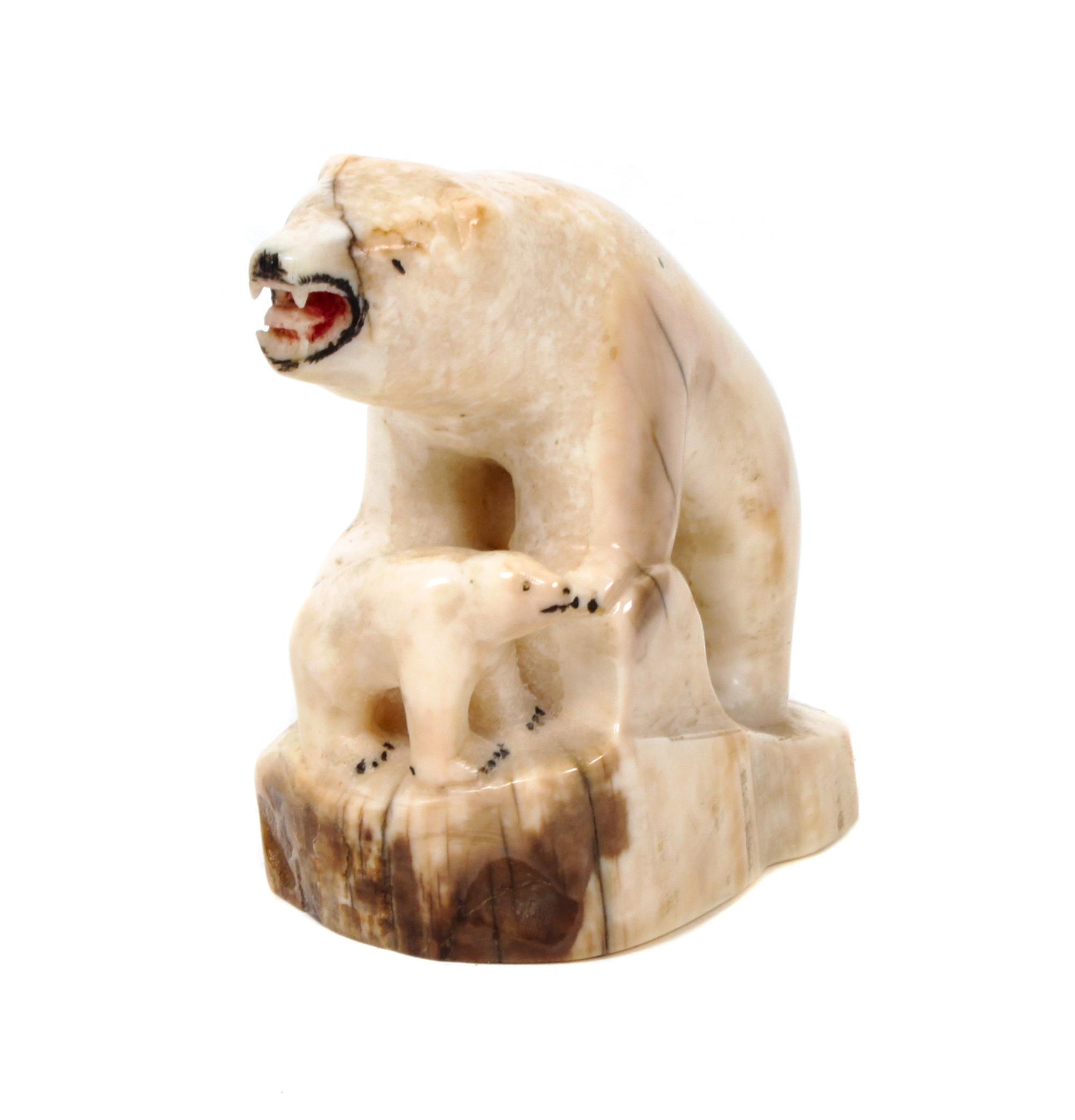 An Inuit Carved Walrus Bone Figurine Height 3 x width 3 5/8 inches.