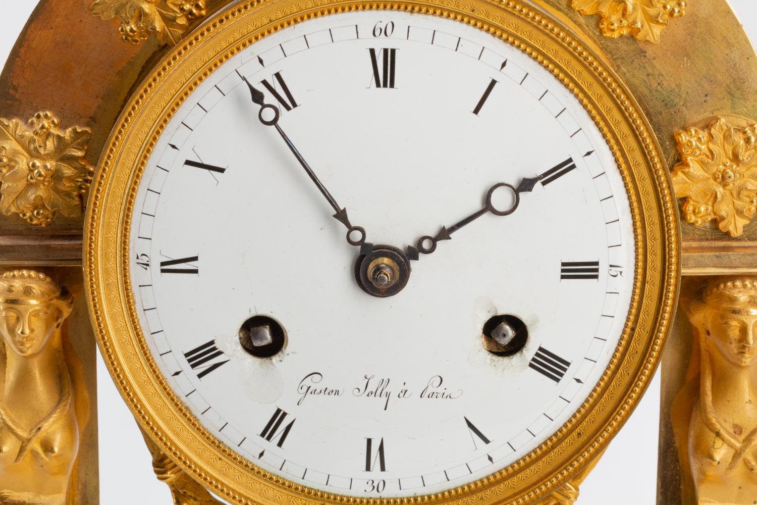 An Empire Gilt Bronze Clock