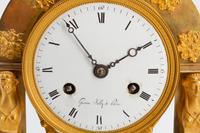 An Empire Gilt Bronze Clock
