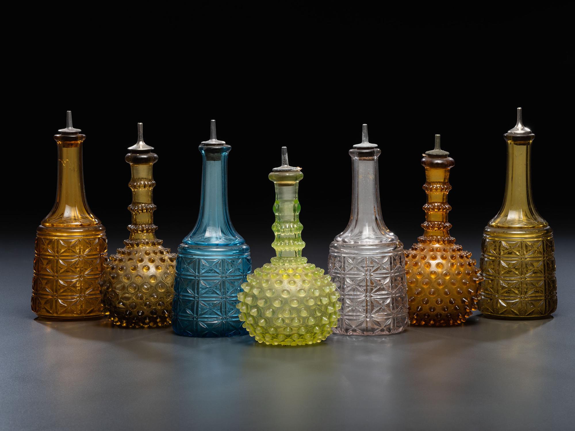 Seven Glass Barber Bottles