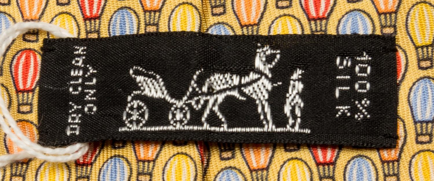 A Group of Three Hermes Silk Ties, 3.15" wide.