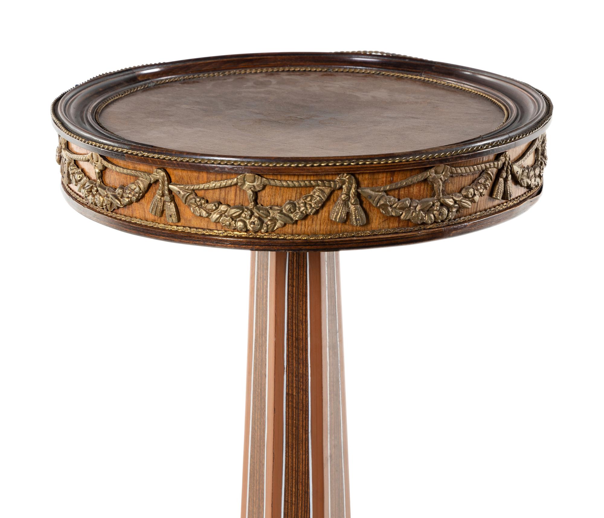 An Empire Style Gilt Metal Mounted Fruitwood Pedestal Table
