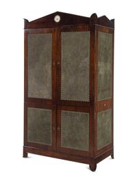 A Regency Style Suede-Inset Mahogany Armoire