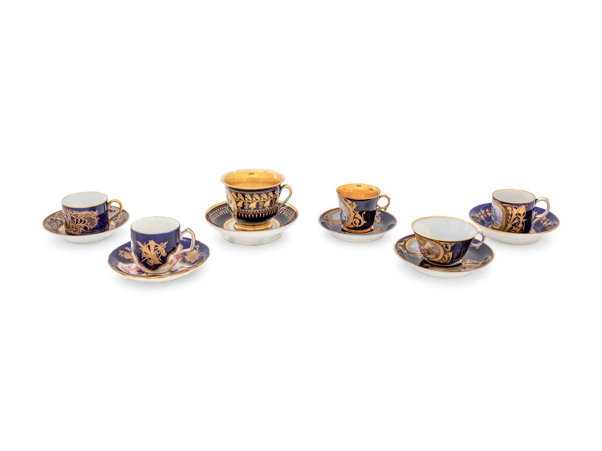An Assembled Set of Six Sèvres Style Painted and Parcel Gilt Porcelain Teacups and Saucers