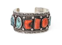 A Navajo Coral and Silver Bracelet, Jerry Roan Length 5 1/2 x opening 1 x width 1 1/4 inches.