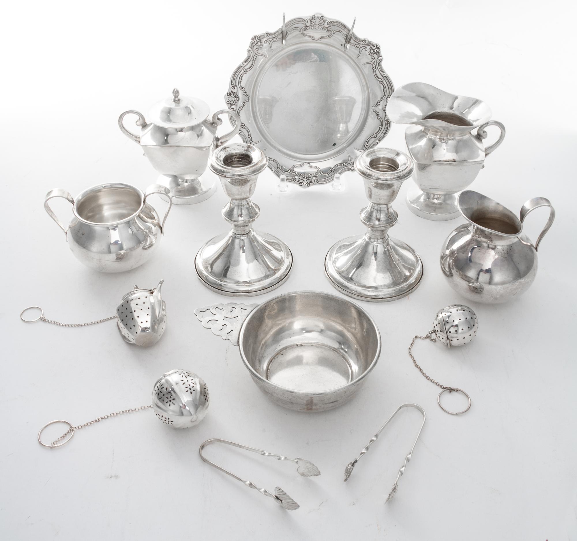 A Collection of American Silver Articles, Various Makers, comprising three tea strainers, a saucer, two sugar tongs, two sugars, two cr