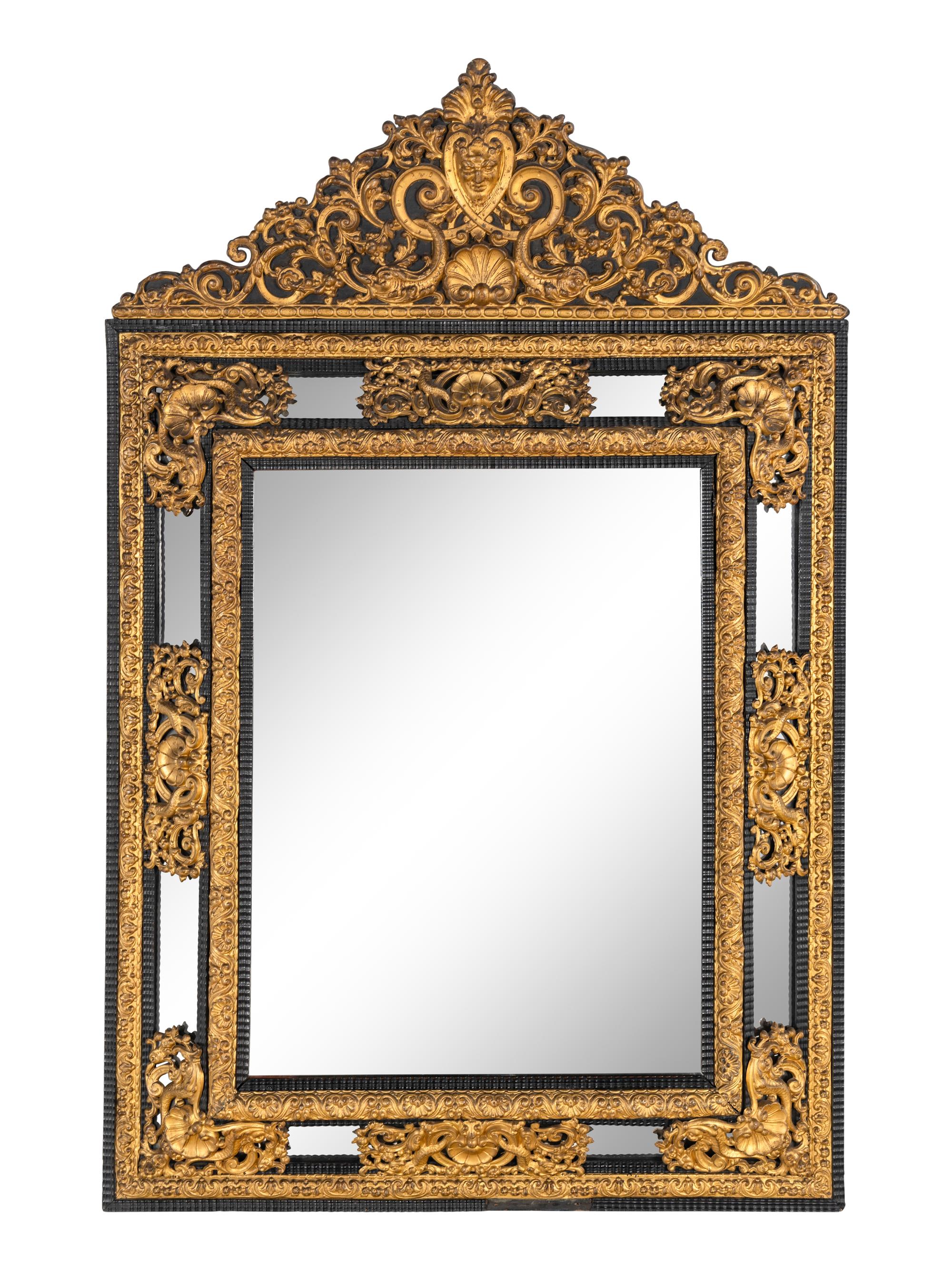 A Régence Style Gilt Pressed Metal and Ebonized Ripple-Molded Mirror