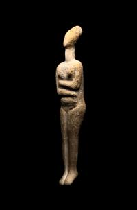 A Cycladic Marble Reclining Female Figure