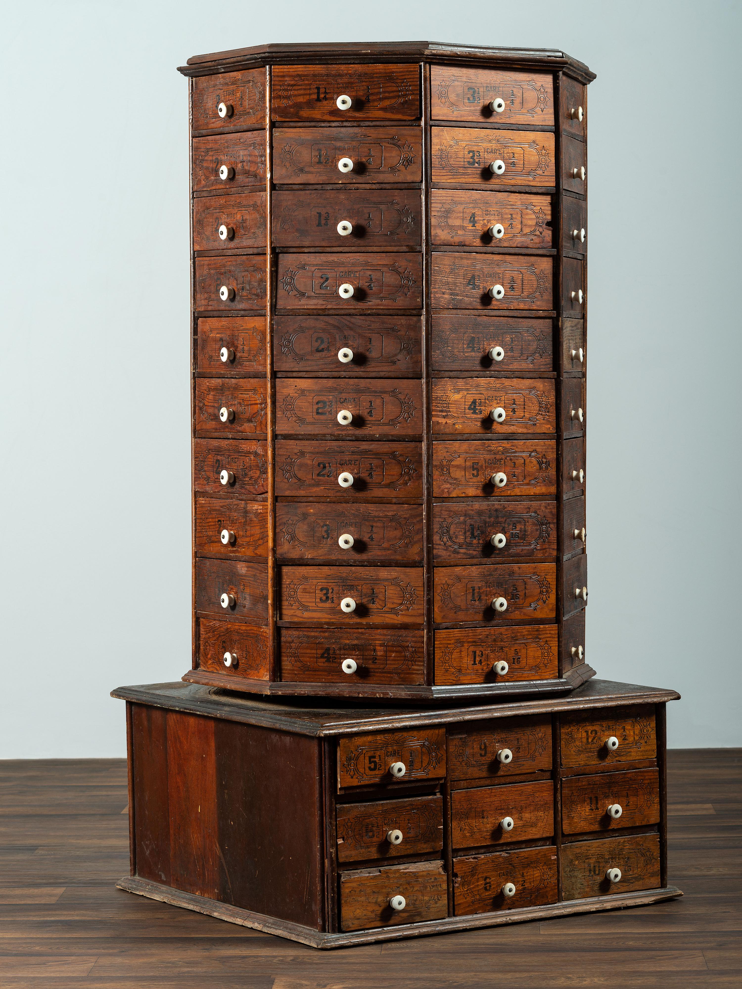 An American Bolt and Screw Case Company Stenciled Pine Octagonal Rotating Cabinet