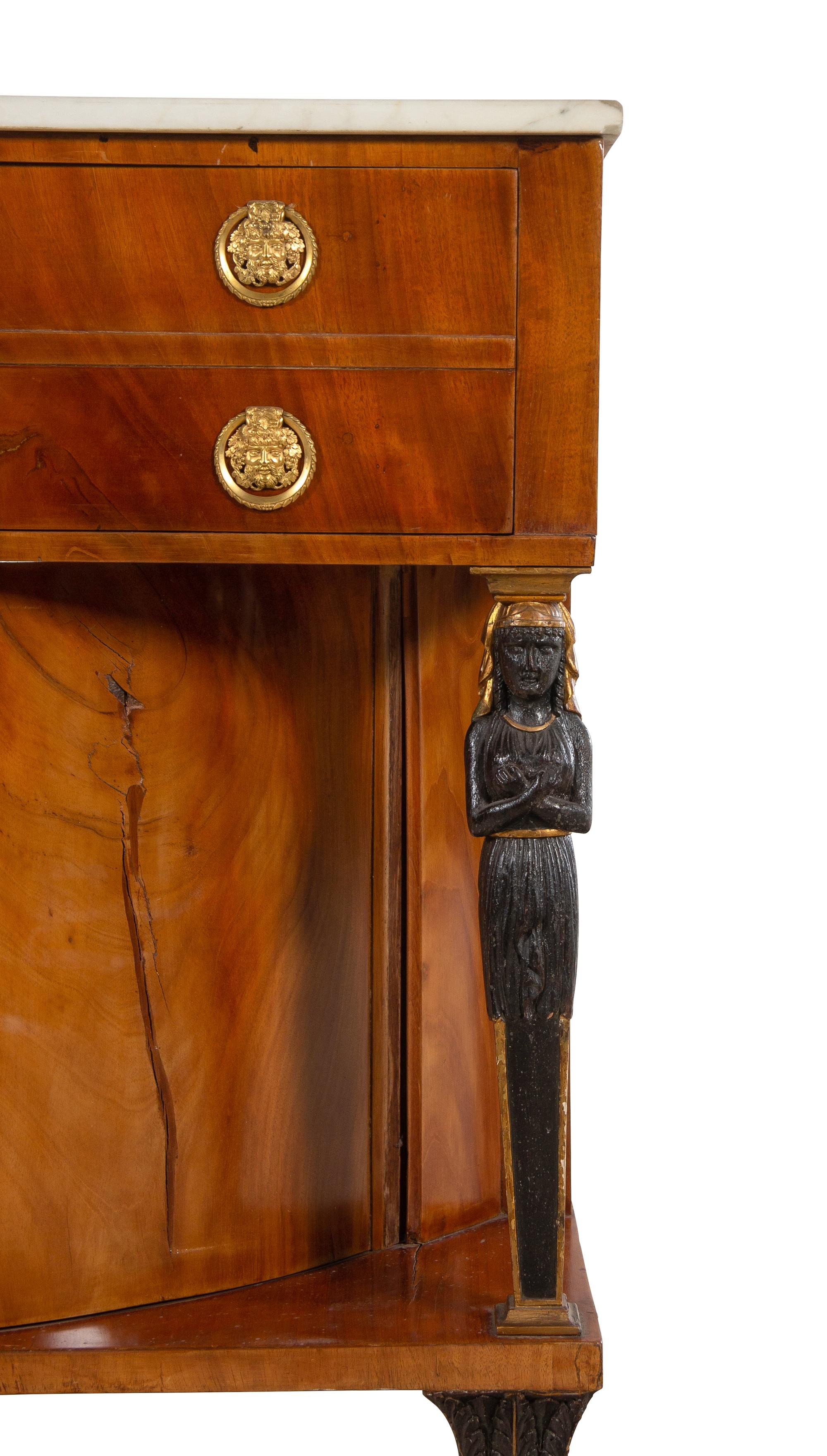 A Russian or Baltic Neoclassical Parcel Ebonized and Gilt Bronze Mounted Mahogany Marble-Top Cabinet