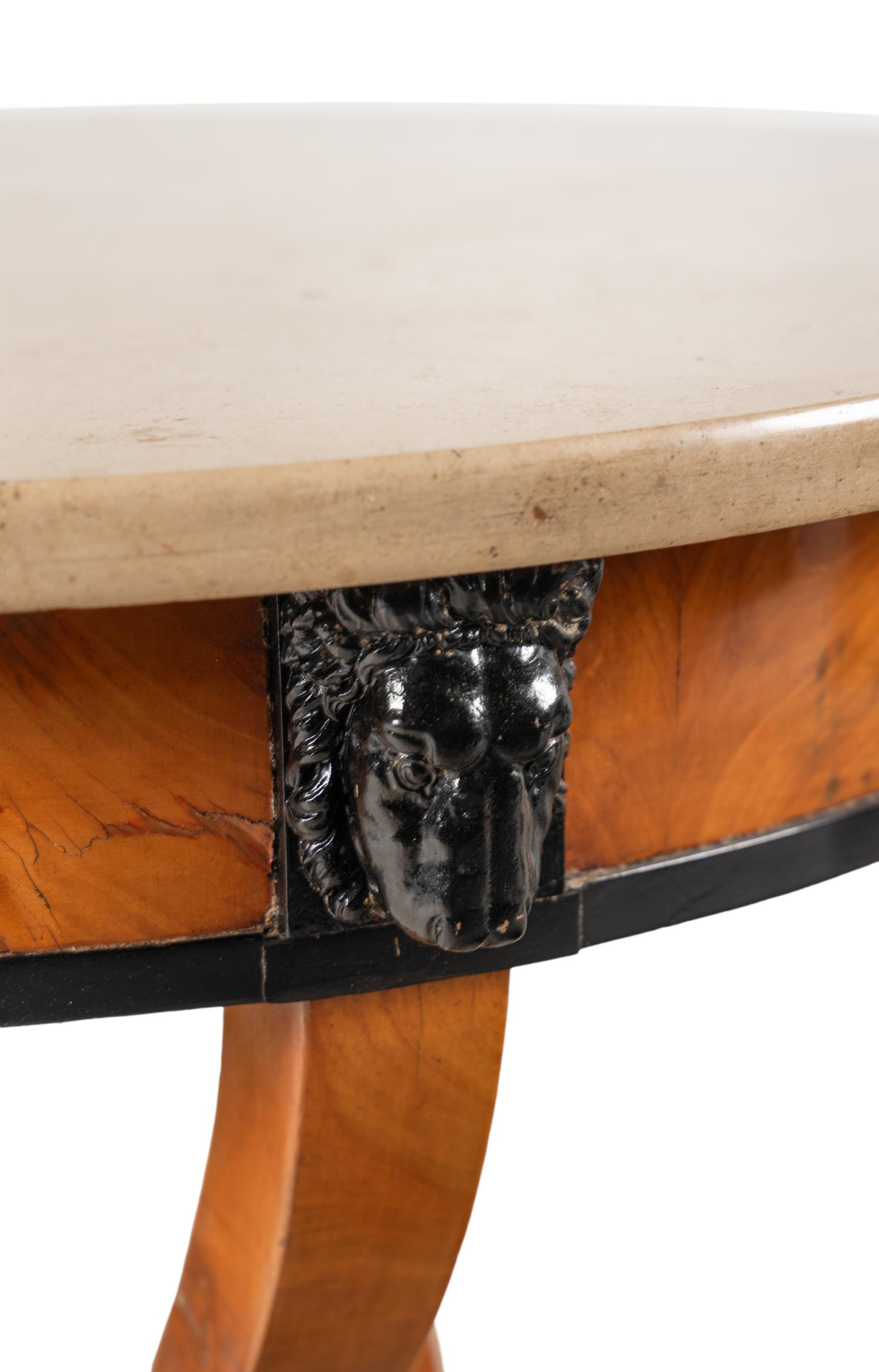 A Continental Parcel Ebonized Birch Marble-Top Center Table