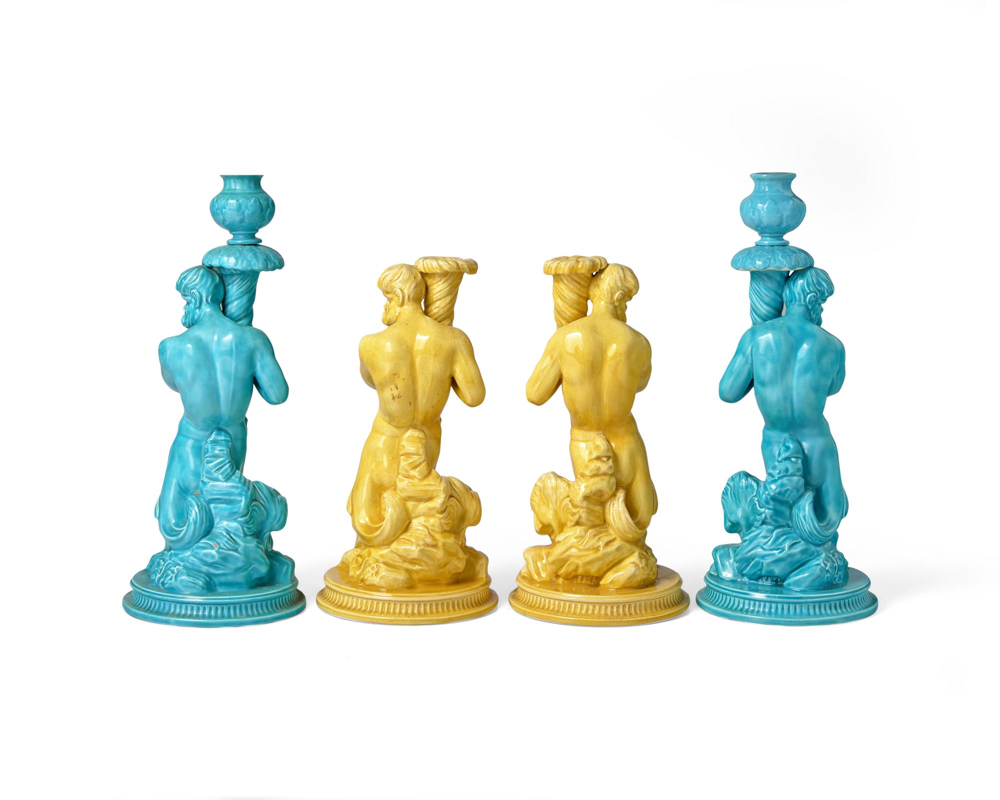 Two Pairs of Wedgwood Majolica ‘Triton’ Figural Candlesticks