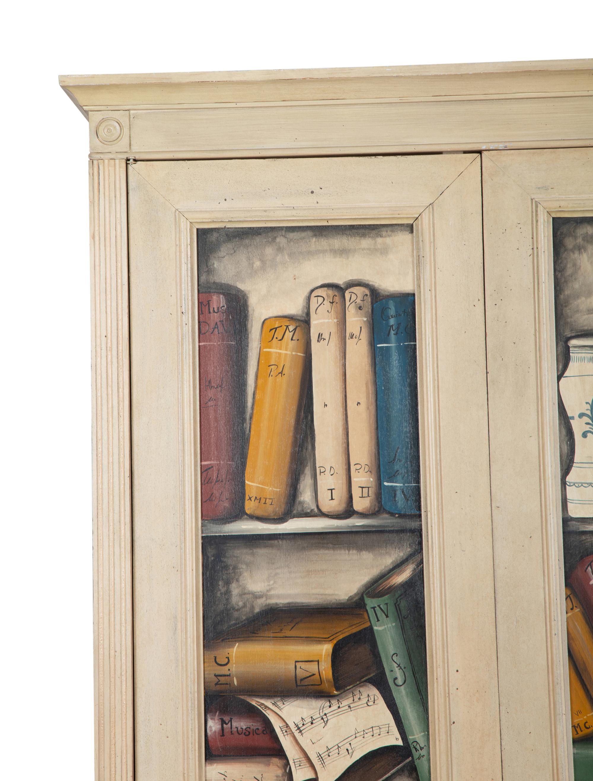 An Italian Painted Armoire with Book Decoration to the Doors