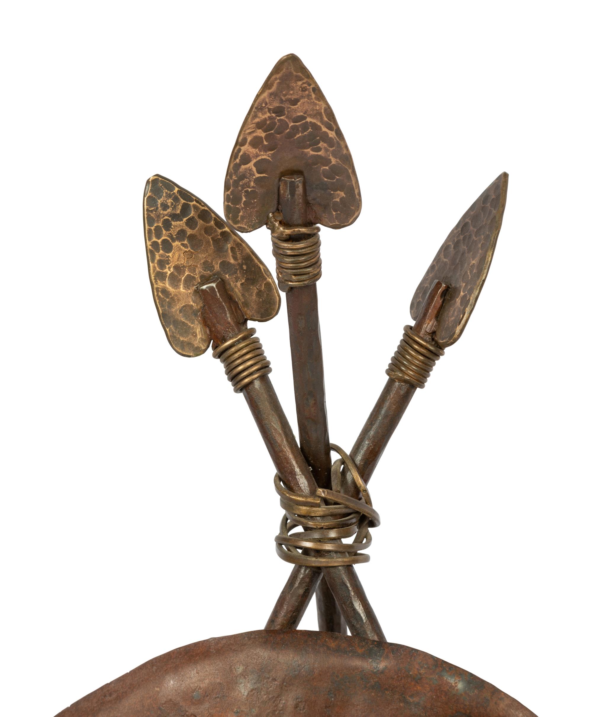 A Bronze Sculpture of a Buffalo Skull Mounted on a Shield and Arrows