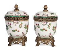 A Pair of United Wilson Gilt Metal Mounted Porcelain Urns