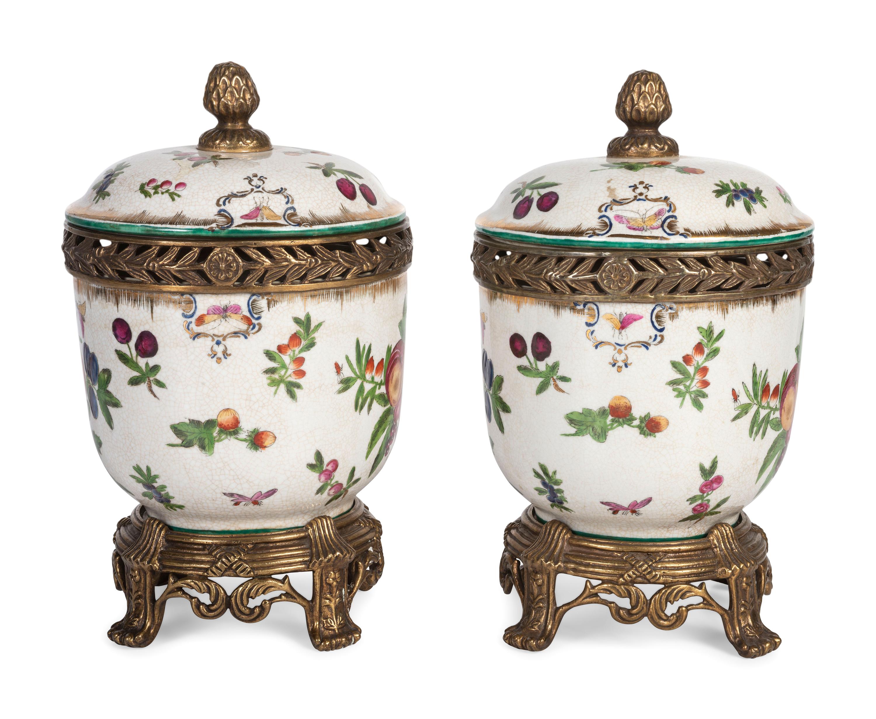 A Pair of United Wilson Gilt Metal Mounted Porcelain Urns