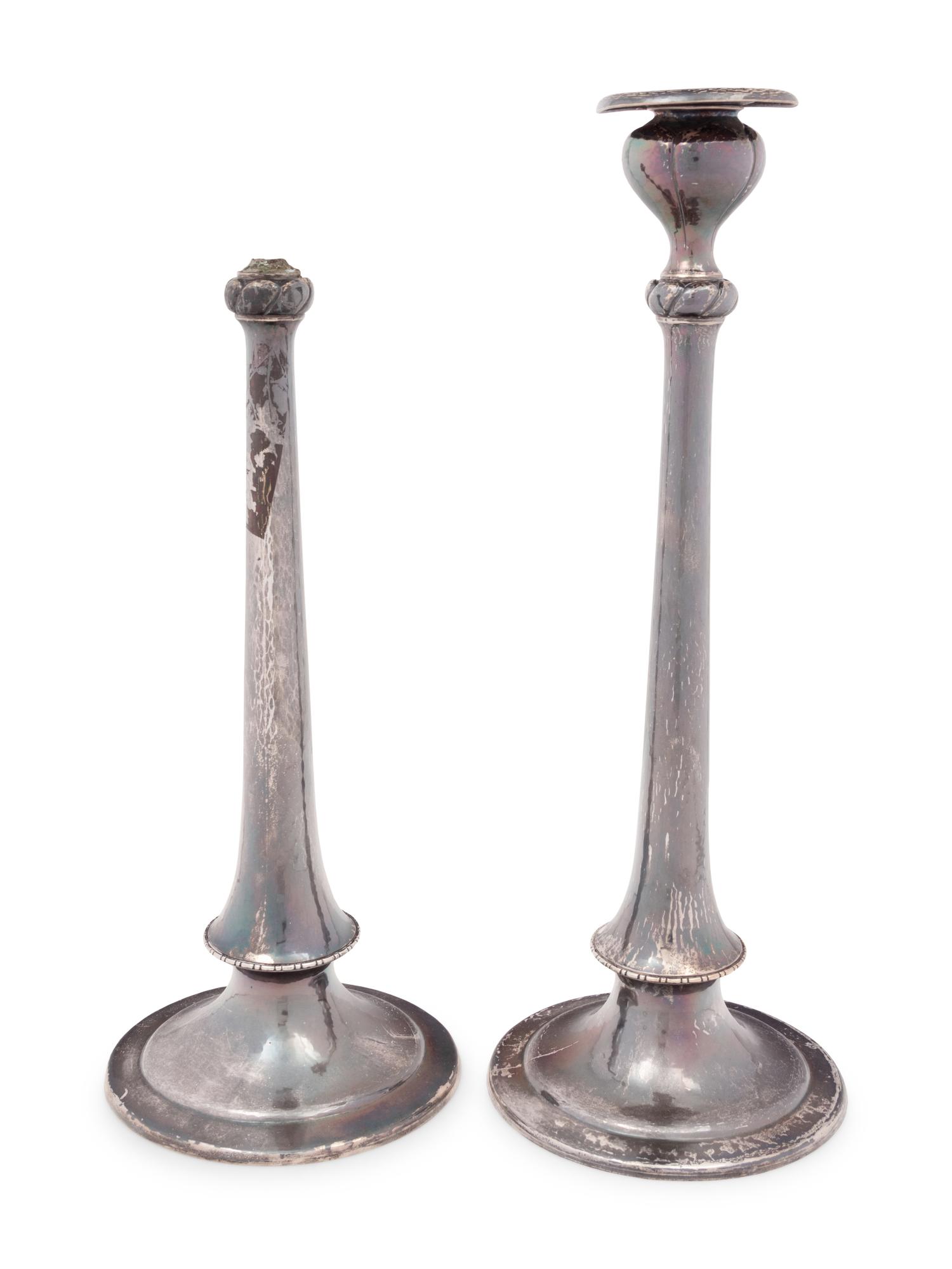 A Pair of Arts & Crafts Spot-Hammered Silver Candlesticks