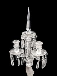 A Set of Four Baccarat Dauphin Three-Light Candelabra