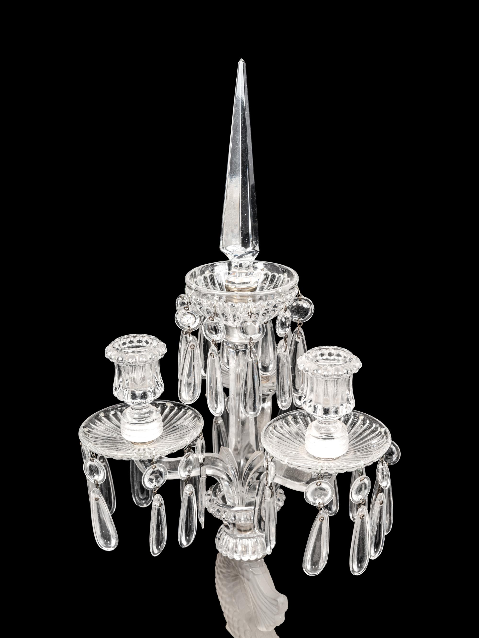 A Set of Four Baccarat Dauphin Three-Light Candelabra