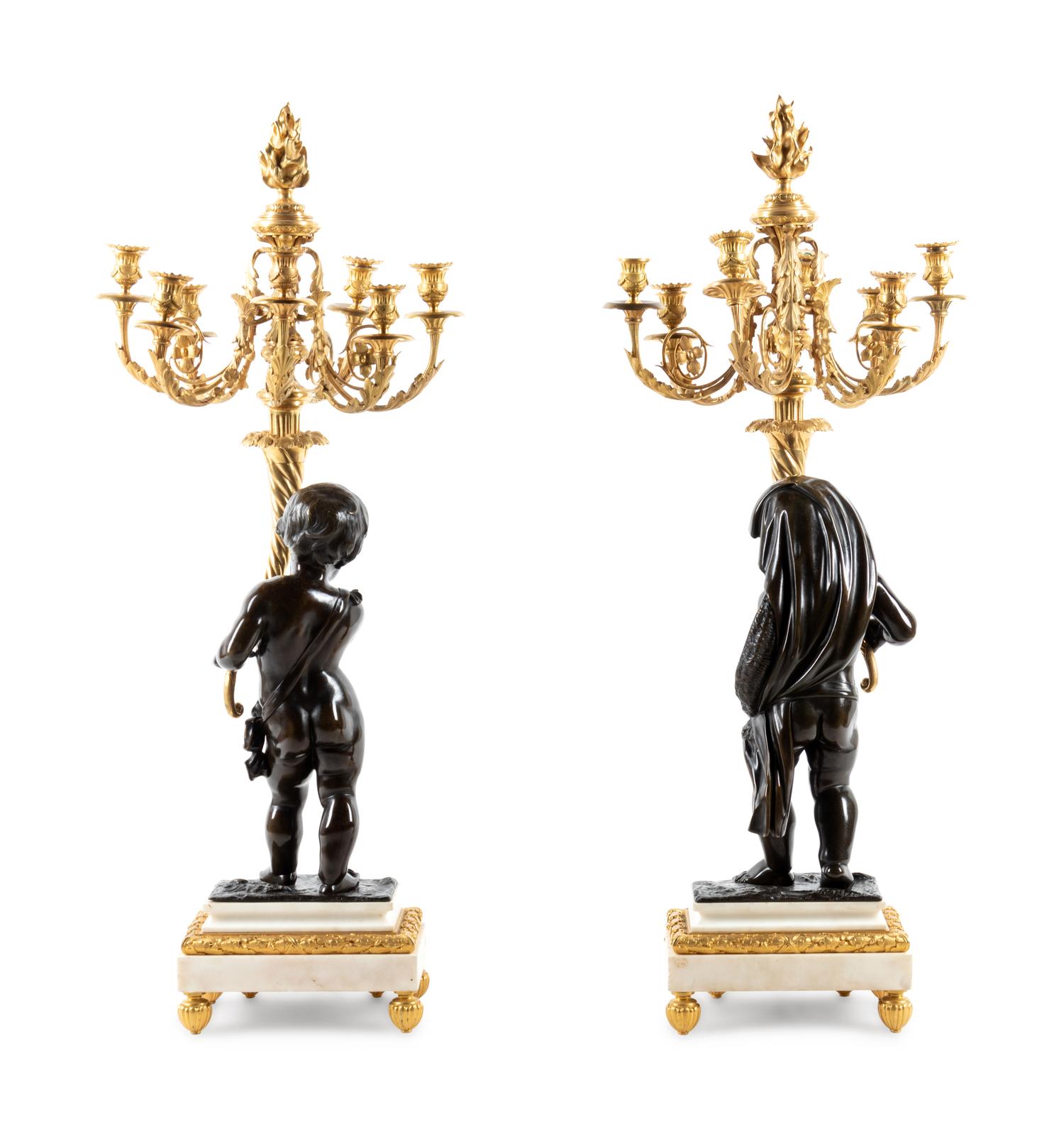 A Fine Pair of Large Louis XVI Style Marble and Parcel Gilt Bronze Figural Seven-Light Candelabra