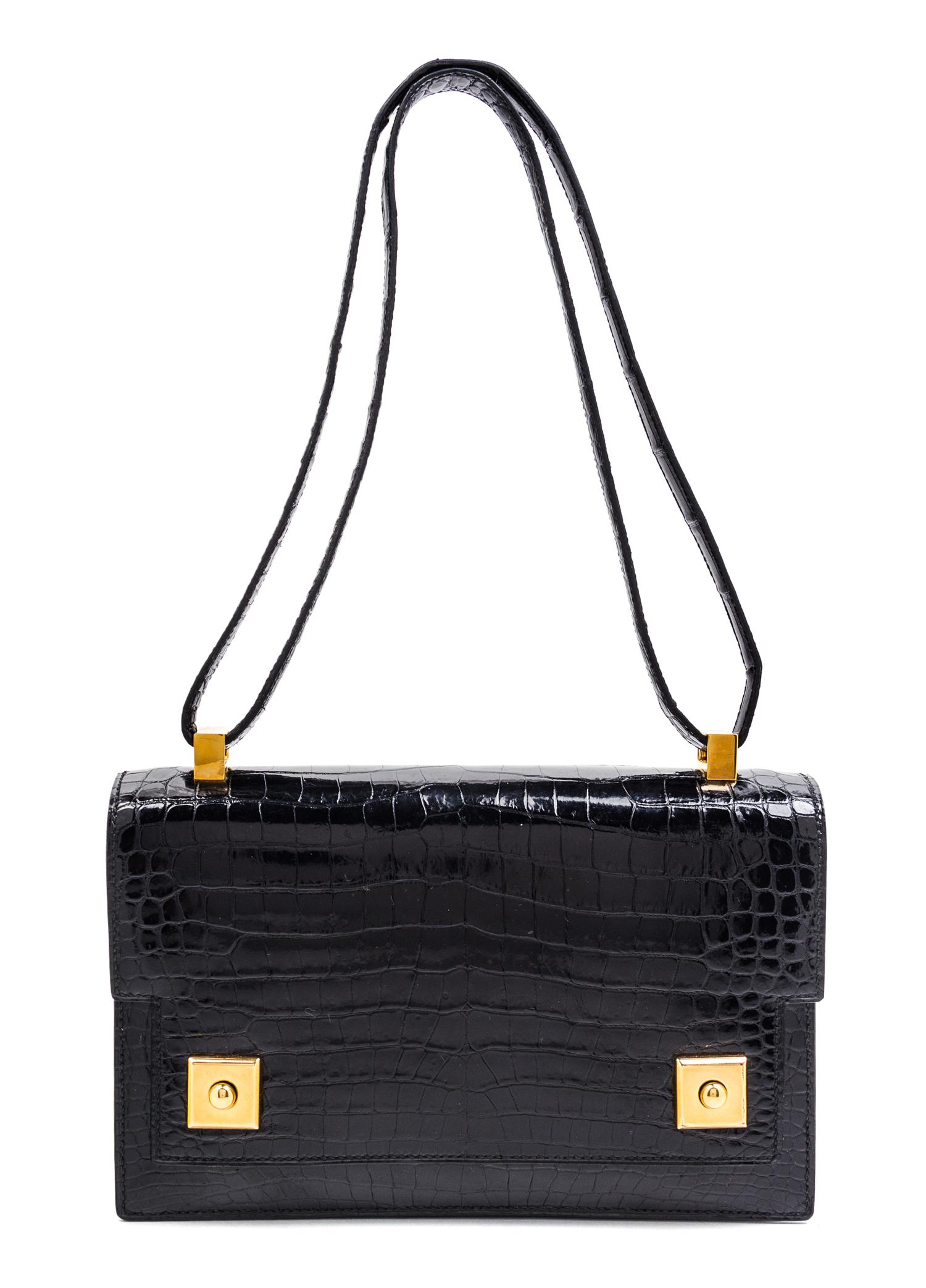 An Hermes Black Crocodile Piano Handbag, 9" x 6" x 2".