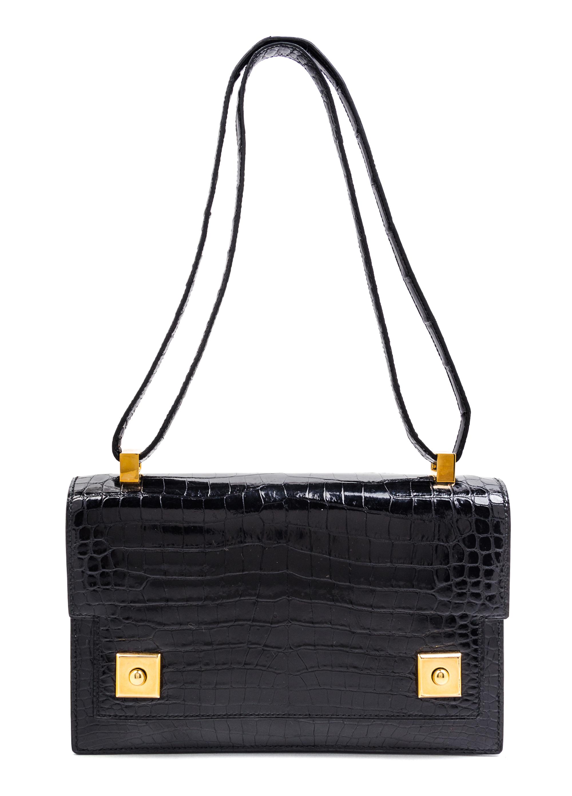 An Hermes Black Crocodile Piano Handbag, 9" x 6" x 2".