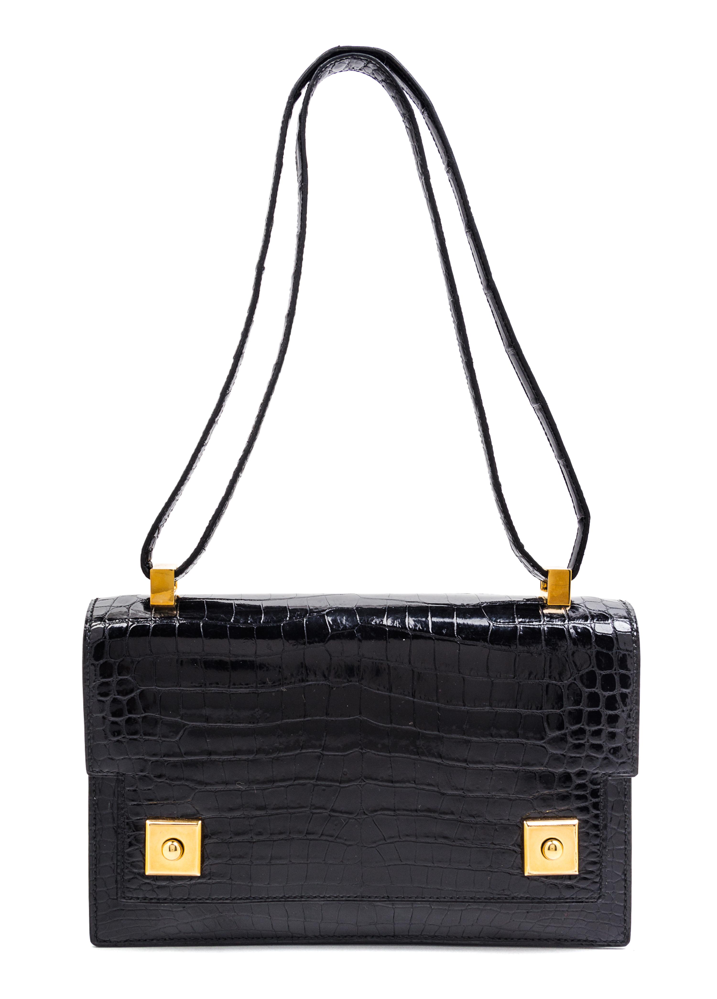 An Hermes Black Crocodile Piano Handbag, 9" x 6" x 2".