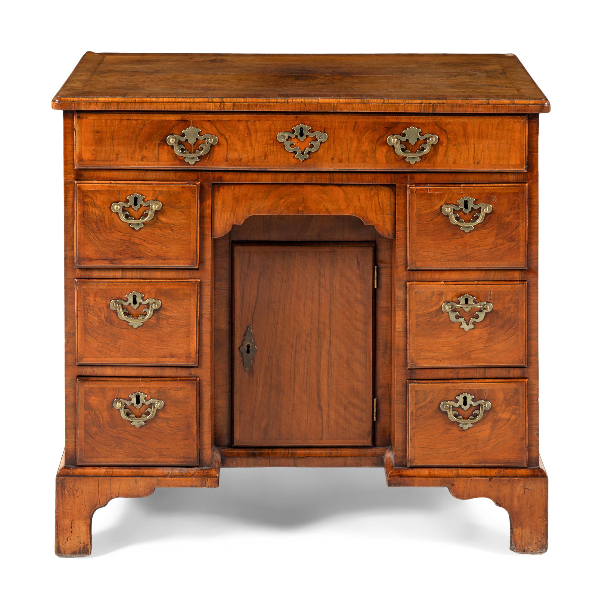 A George II Walnut Kneehole Desk