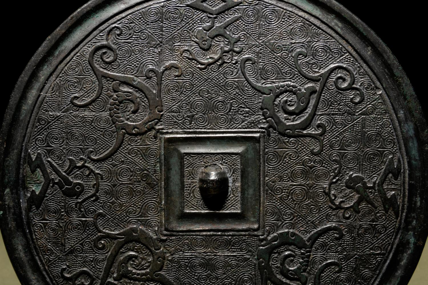 A Bronze Circular 'Phoenix’ Mirror