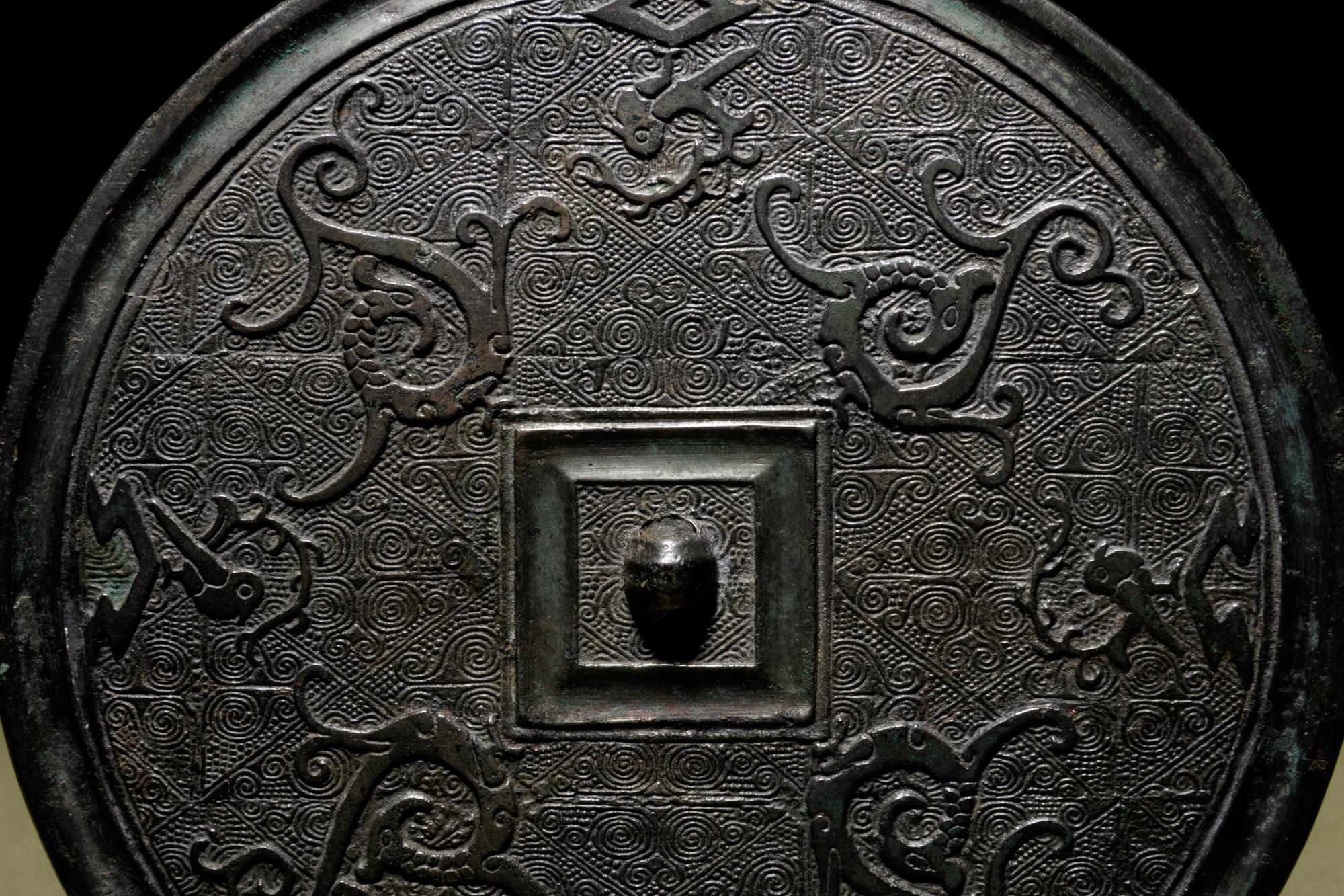 A Bronze Circular 'Phoenix’ Mirror
