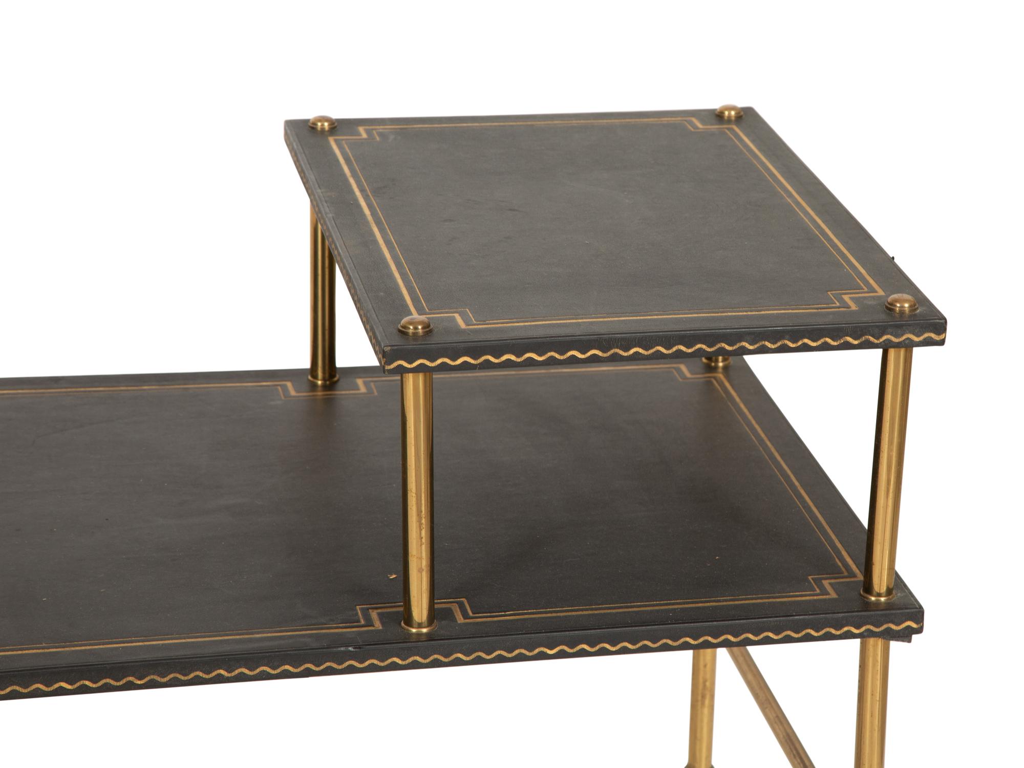 A Pair of Brass and Leather Two-Tier Side Tables